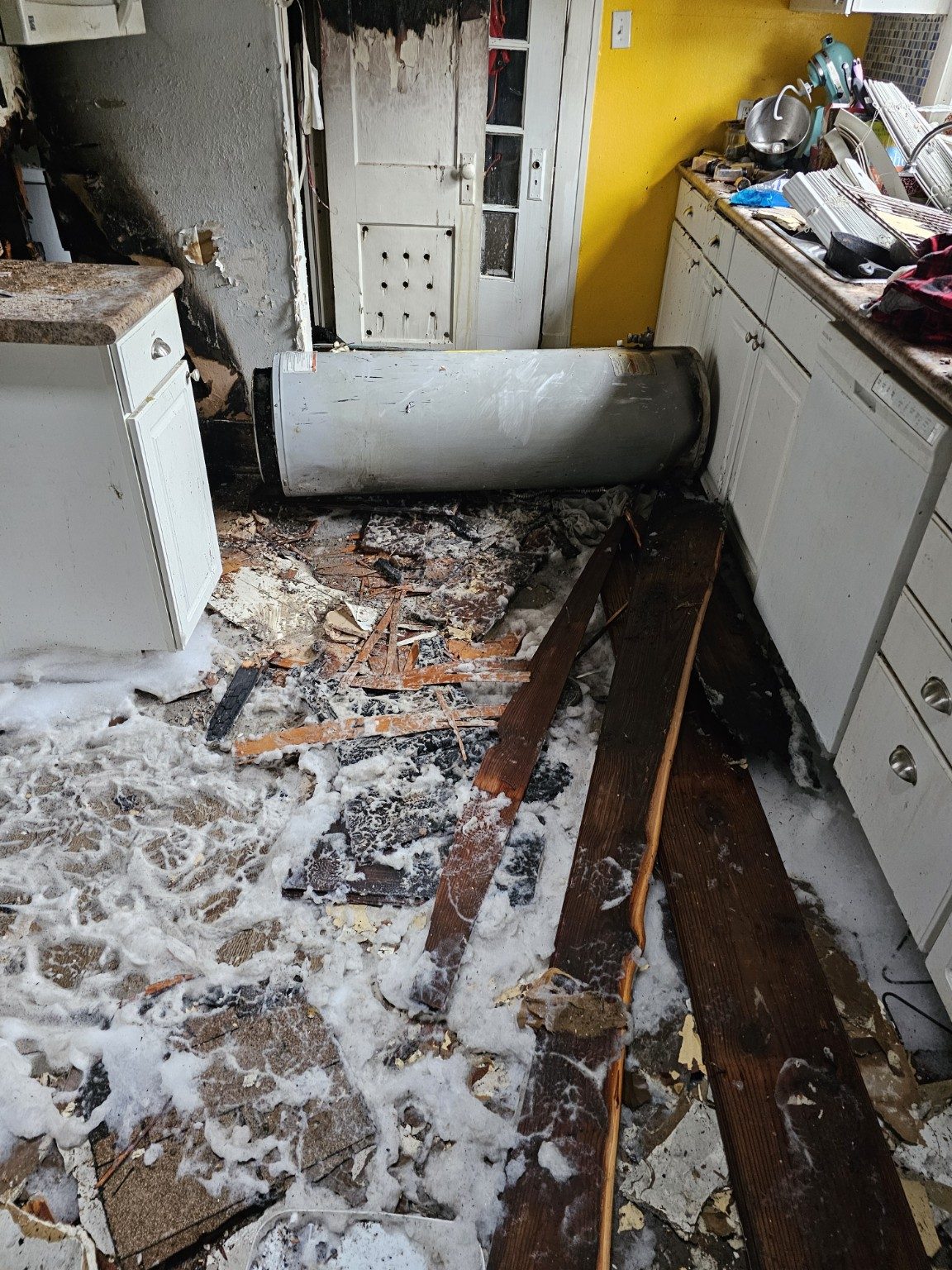 Interior of a home with fire and water damage before restoration work begins